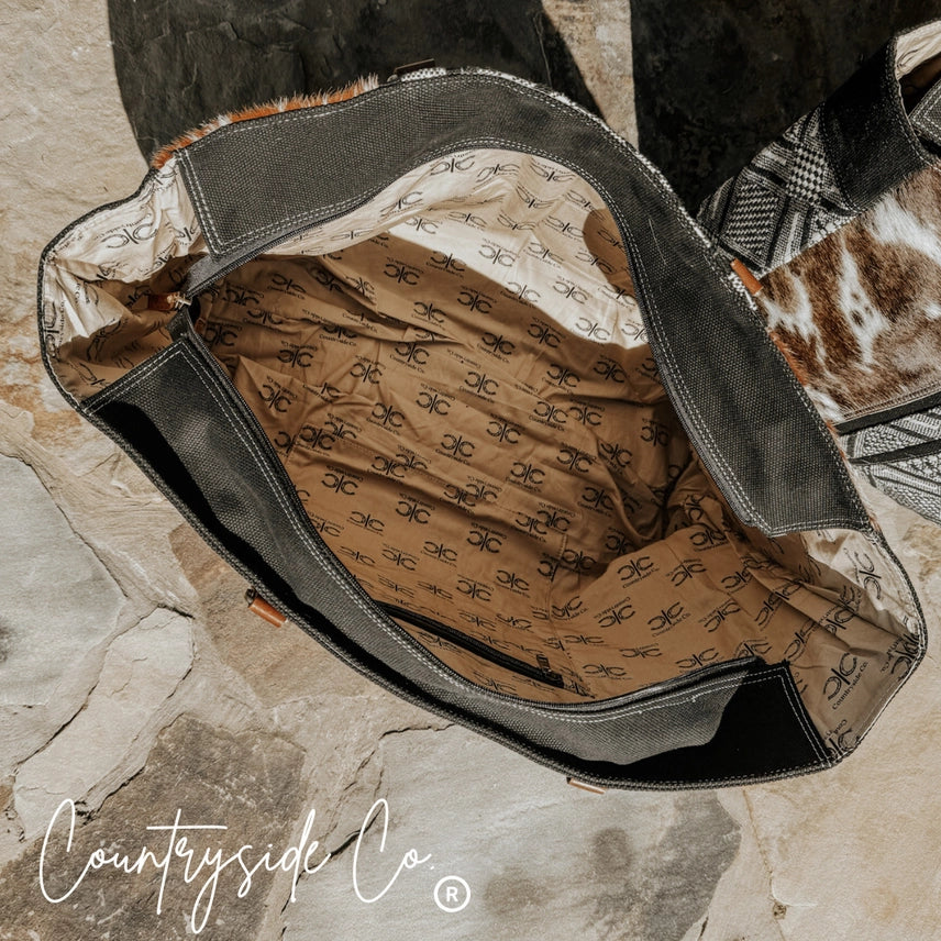 Bolso de fin de semana Charlene de piel de vaca ✈️🖤