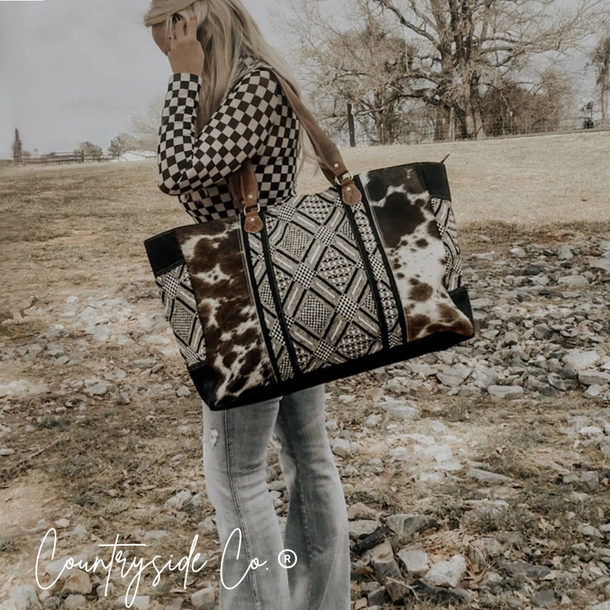 Bolso de fin de semana Charlene de piel de vaca ✈️🖤