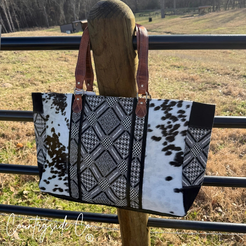 Bolso de fin de semana Charlene de piel de vaca ✈️🖤